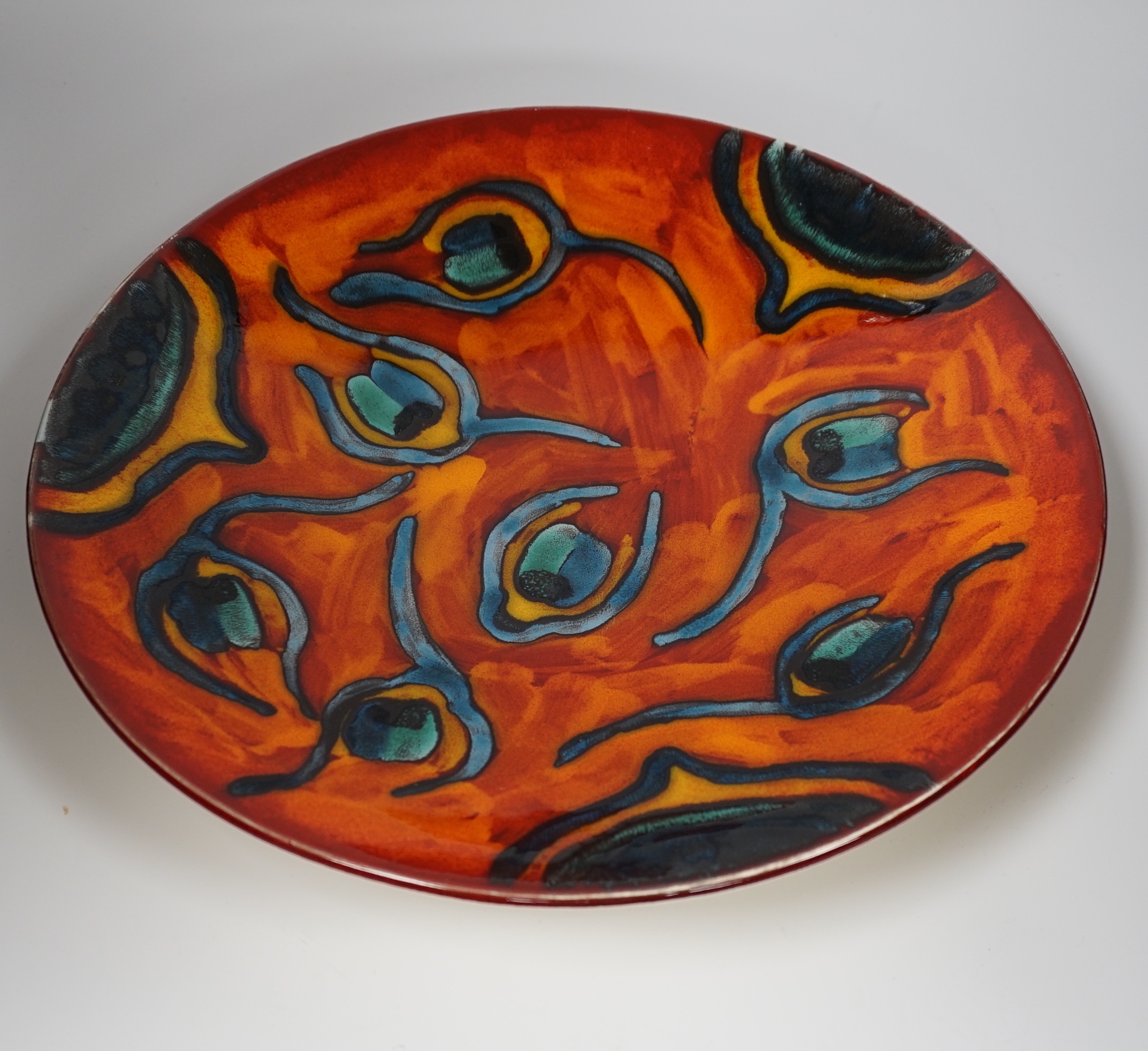 Two Poole Pottery Delphis chargers, both late 20th century, largest 41cm in diameter